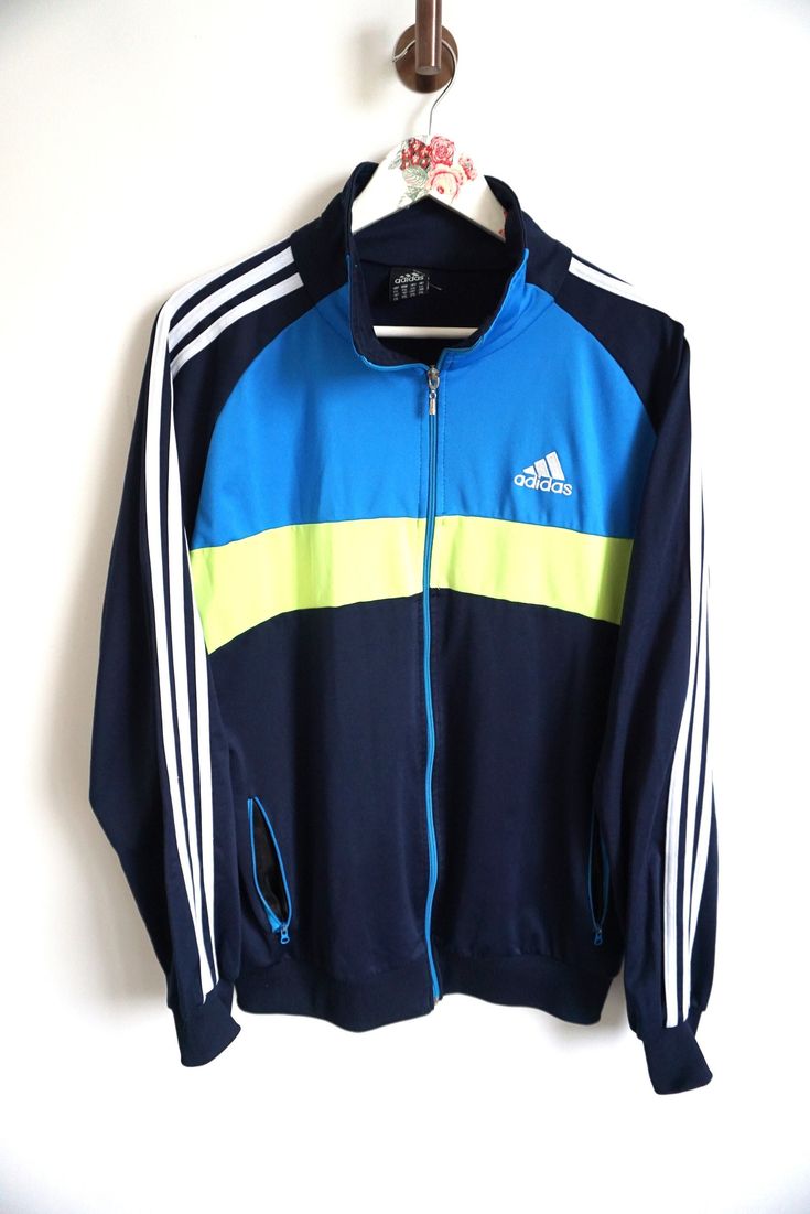 Jacket details: * Adidas windbreaker / sweatshirt * Blue / Green * Condition: Perfect vintage condition Measurements, laying flat: Length: 28 1/2" / 72 cm Armpit to armpit: 26 1/2" / 67 cm Cuff to Sleeve: 21 1/2" / 56 cm Label size: L / XL / XXL Feel free to message me with any questions. Cotton Long Sleeve Track Jacket For Jogging, Cotton Sportswear Track Jacket For Jogging, Long Sleeve Sportswear Tracksuit For Sports Season, Long Sleeve Sportswear Tracksuit For Sports, Long Sleeve Tracksuit For Sports Season, Sporty Long Sleeve Tracksuit For Workout, Cotton Track Jacket With Three Stripes For Sports, Blue Long Sleeve Tracksuit For Gym, Sportswear Long Sleeve Outerwear For Jogging