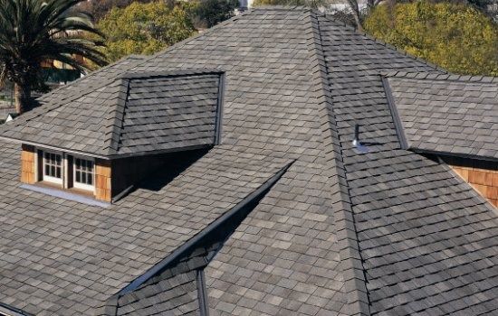 an aerial view of a house with two windows and a roof made of shingles