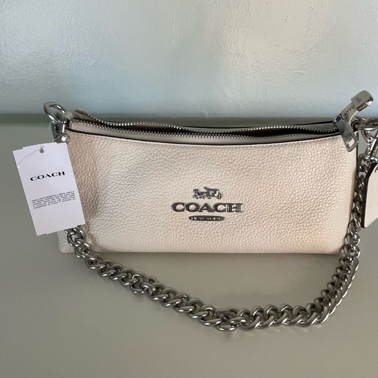 Silver/Chalk. 100% Authentic With Tags Included. Straight From Woodbury Common Premium Outlets. Dm If Any Questions. Coach Charlotte Bag, Designer Cream Bag With Silver-tone Hardware, Modern Cream Shoulder Bag With Branded Hardware, White Coach Evening Bag, White Clutch Bags With Silver-tone Hardware, Coach Cream Pouch Shoulder Bag, Coach White Pouch Shoulder Bag, Cream Bags With Silver-tone Hardware For Daily Use, White Coach Pouch Shoulder Bag