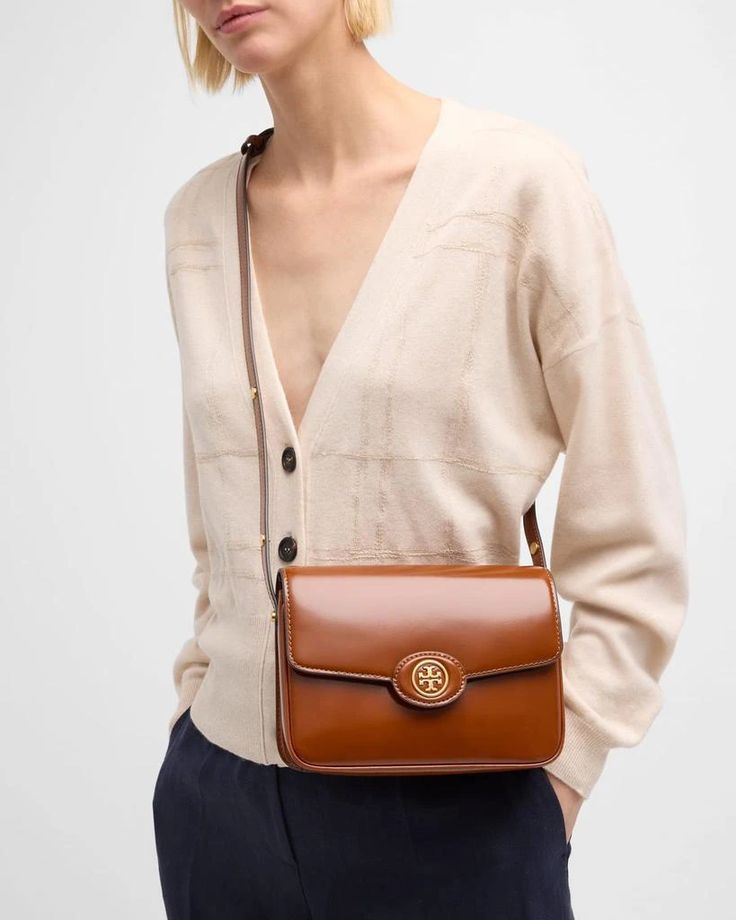 Tory Burch 'Robinson' shoulder bag in spazzolato patent leather.Adjustable shoulder strap.Flap top with snap closure; T monogram accent.Interior, one slip pocket.Lining: Polyurethane.Approx. 6.1'H x 8.3'W x 2.4'D.Imported High-end Travel Shoulder Bag With Cc Turnlock Closure, Classic Business Flap Bag With Cc Turnlock Closure, Modern Business Shoulder Bag With Cc Turnlock Closure, Modern Shoulder Bag With Cc Turnlock For Business, Classic Flap Bag With Cc Turnlock Closure, Luxury Tan Shoulder Bag With Adjustable Strap, Designer Shoulder Bag With Cc Turnlock For Business, Chic Shoulder Bag With Cc Turnlock For Business, Classic Travel Bag With Cc Turnlock Closure