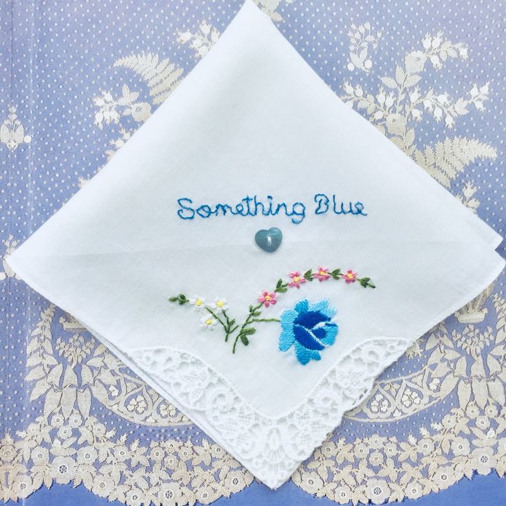 "One of a kind new and unused hand embroidered 'Something Blue' vintage cotton lawn handkerchief circa 1950. This delightful handkerchief is made from 100% white cotton. The handkerchief depicts a machine embroidered blue rose with little white and pink flowers in one corner. Blue roses are often portrayed in literature and art as symbols of love and prosperity. The floral motif is set off with delightful guipure lace at one corner. The other sides of the handkerchief are plain and finished off Vintage Handmade Wedding Handkerchiefs, Blue Embroidered Wedding Handkerchief, Blue Embroidered Handkerchief For Wedding, Blue Embroidered Handkerchiefs For Wedding, Vintage Floral Embroidery Wedding Handkerchiefs, Vintage Blue Wedding Handkerchiefs, Blue Vintage Wedding Handkerchiefs, Vintage Blue Handkerchiefs For Wedding, Blue Embroidered Handkerchiefs For Gifts