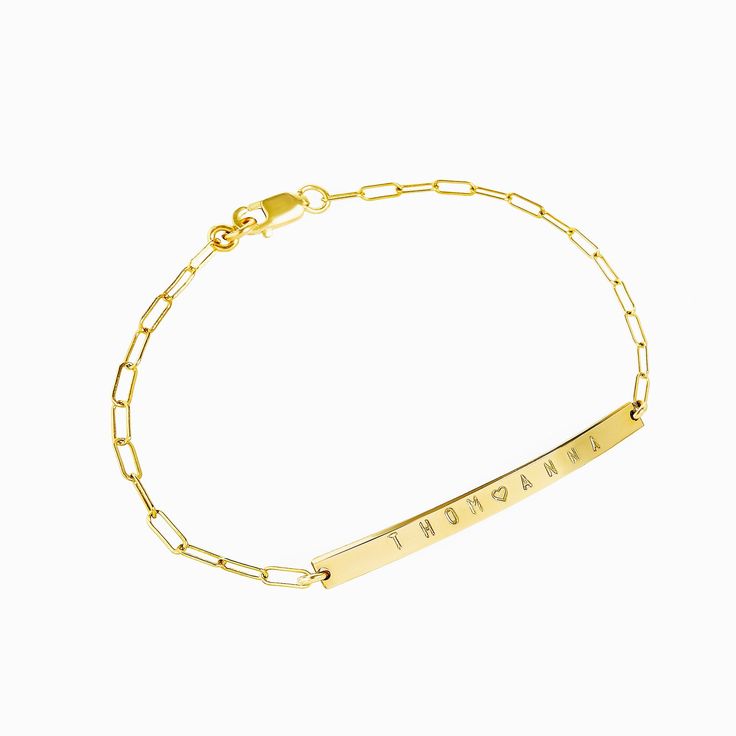 "Personalize our our skinny link chain bar bracelet as a constant reminder of those you love. We can engrave the bar with up to 15 characters on the front side with: Numerals, letters, the period mark, an ampersand, and a heart. Bracelet features a beautiful 'rectangle' style link chain. We use a heavy gauge metal to create all our nameplates which gives this piece a high quality look. Our nameplates are rock solid and will not bend out of shape! All jewelry is beautifully packaged in our logo e Engraved Bar Bracelet, Jewelry Name, Paperclip Bracelet, Bridesmaids Jewelry, Arrow Bracelet, Bar Bracelet, Link Chain Bracelet, Bridesmaid Bracelet, Silver Chain Bracelet