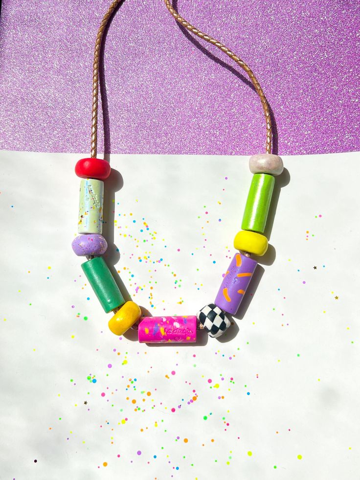 ✿ Bold & unique wearable art Utopic Color Charm Necklace ✿ Made with various shaping techniques ✿ Multicolored & textured handcrafted beads ✿ One of a kind design. Each necklace is distinct from the next ✿ Extremely durable leather cord ✿ Worldwide international shipping Whether you're planning to go to a concert, a festival, a birthday party, a night out with friends, the beach, or the supermarket, delicately handcrafted Utopic Color Charm Necklace adds a unique touch to your outfit! Artistic Handmade Beaded Necklaces For Festivals, Artistic Handmade Beaded Necklace For Festival, Artistic Multicolor Handmade Beaded Necklace, Handmade Retro Necklaces For Festival, Retro Handmade Necklaces For Festival, Handmade Retro Necklace For Festivals, Handmade Retro Necklace For Festival, Retro Handmade Necklace For Festival, Artsy Handmade Beaded Necklaces For Festivals