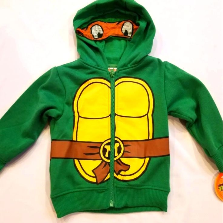 Teenage Mutant Ninja Turtles Hoodie Coat Jacket. Size 2t Cotton/Polyester Stylish Hoodie With Super Cute Tmnt Design On Front, Back And Hood. Hood Zip-Up Front For Easy Access Perfect For Dress-Up And Every Day Wear Machine Wash Cold; Officially Licensed Comes From A Pet And Smoke Free Home. Playful Outerwear With Drawstring Hood And Long Sleeves, Playful Long Sleeve Outerwear With Drawstring Hood, Hooded Outerwear With Drawstring Hood For Playtime, Playful Hoodie Outerwear For Winter, Playful Winter Hoodie Outerwear, Fall Hooded Outerwear For Playtime, Fall Outerwear With Drawstring Hood For Playtime, Hooded Winter Outerwear For Playwear, Cotton Long Sleeve Outerwear For Play