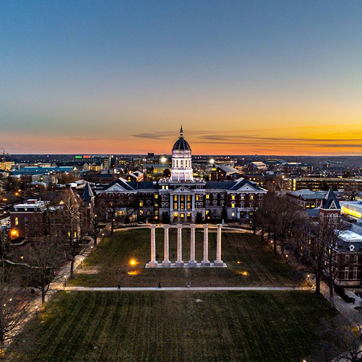 an aerial view of the capital building at dusk