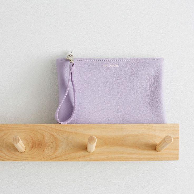 Our Lilac leather clutch bag is perfect for any event where you need a stylish clutch bag to store you essentials in. It comes with a detachable wrist strap that is fastened with a lobster clip - for easy removal when you are wanting to have a handheld clutch bag option.   We also offer this clutch bag on its own or with the option to add a matching card holder to go inside the bag, to keep all your cards in one place.  Made from high quality soft Italian lilac leather and a YKK zip fastening. Each bag is stamped with the RHE AMORE logo, under the stitching line. Product Measurements Width - 21.5cm Depth (top of bag to bottom) - 15cm Strap length - 13cm Please allow a tolerance of +/- 0.5-1cm on the above measurements due to the handmade nature of this product. Pouch Clutch With Card Slots, Soft Leather Clutch For Daily Use, Daily Use Soft Leather Pouch Clutch, Soft Leather Clutch Wallet, Soft Leather Handheld Clutch For Daily Use, Daily Use Soft Leather Handheld Clutch, Daily Use Handheld Soft Leather Clutch, Smooth Grain Clutch Pouch For Daily Use, Daily Use Clutch With Interior Card Slots