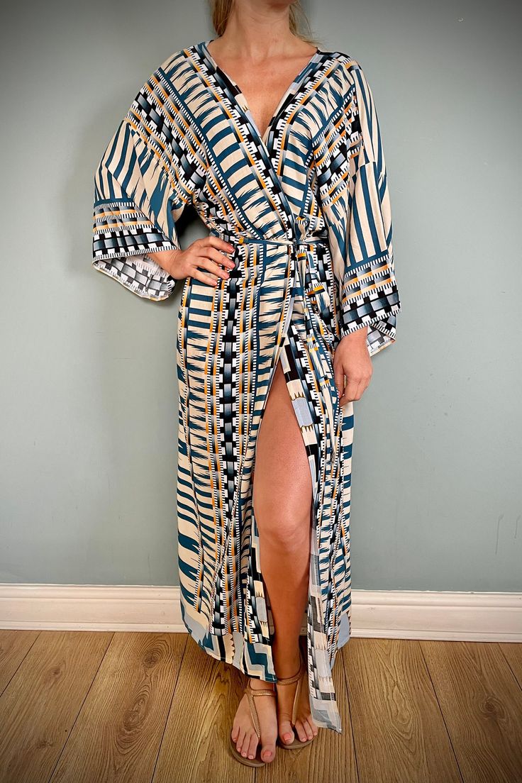 Ideal Christmas gift, Beautiful, vintage / Boho style sustainable Cotton kimono, long sleeves and tie belt. Beautifuly soft cotton, comfy and roomy to wear.  Lightweight cotton in teal blue with Aztec print. 100%  COTTON, machine washable Free Size fits U.K. 8 to 14 Boho style Cotton dressing gown, kimono robe. Great to wear around the house or to dress up with some jeans & a T shirt to go out.  A luxurious birthday or Christmas gift idea. We can pop it in the post with a personal message to a f Beige Long Sleeve Maxi Dress For Beach Cover-up, Blue Kimono With Tie Waist And Kimono Sleeves, Chic Long Sleeve Kimono For Loungewear, Blue Kimono With Tie Waist, Chic Long Sleeve Loungewear Robe, Chic Long Sleeve Maxi Dress For Beach Cover-up, Flowy Long Sleeve Kimono For Loungewear, Beige Long Sleeve Kaftan For Beach Cover-up, Long Sleeve Printed Loungewear Dress