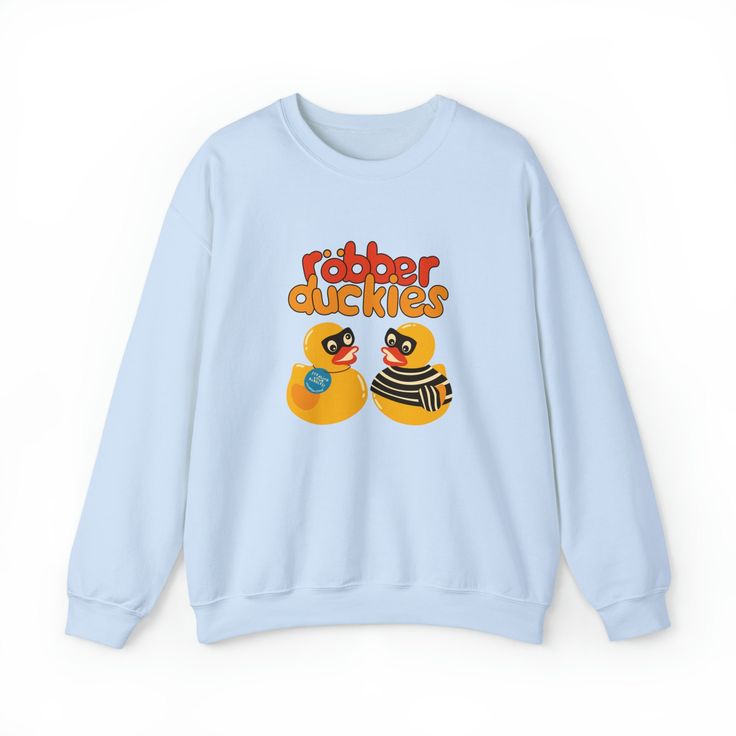 This rubber ducks sweatshirt.. or should we say Robber Ducks is a funny sweatshirt and kawaii sweater, sweatshirt, crewneck, pullover or whatever you may call it to add to your kawaii clothing collection. This charming kidcore sweatshirt will surely bring smile to anyone who loves puns or if you just wanna be that one who brings a ray of sunshine in every situation. It's a perfect everyday aesthetic trendy pullover and is a perfect gift for her, gift for him or anyone in between as these sweatshirts are unisex. Available in Small, Medium, Large, XL, 2XL, 3XL, 4XL and 5XL *Order the next size for oversized sweatshirt comfy look. ✨ Milk Designs Original ✨ 50% cotton, 50% polyester ✨ Medium-heavy fabric ✨ Loose fit ✨ Sewn-in label ✨ Runs true to size ‼️ Size Guide in photos, print may appear Cute Cartoon Print Sweatshirt For Streetwear, Cute Sweatshirt With Funny Print And Crew Neck, Cute Crew Neck Sweatshirt With Funny Print, Kawaii Cotton Sweatshirt With Character Print, Cute Cotton Sweatshirt With Cartoon Print, Fun Cotton Sweatshirt With Character Print, Kawaii Letter Print Sweatshirt For Fall, Playful Crew Neck Sweatshirt With Character Print, Cute Crew Neck Sweater With Letter Print