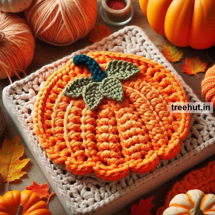 a crocheted pumpkin sitting on top of a table