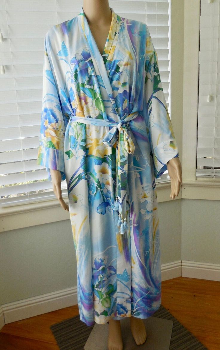 "This is a Gorgeous House Robe. It is a long silky polyester robe with a beautiful flower and butterfly print. This kimono style robe has drop shoulders with side pockets and a wrap around sash belt. It is in Excellent Condition! Label: NATORI Made in Philippines  Size: Small to Large (Double Check Measurements)     Measurements are taken with the garment LAYING FLAT. DOUBLE where applicable. Shoulder to Shoulder:  21\"  Armpit to Armpit:          23\"  Sleeve Length:               18\" Waist: Floral House, Flower And Butterfly, Gorgeous Houses, A Beautiful Flower, Floral Robes, Sash Belts, Womens Kimono, Sash Belt, Kimono Style