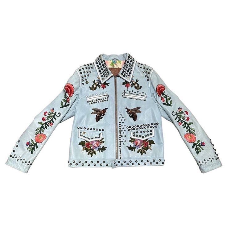 Gucci signed jacket, made of light blue leather with silver hardware. Equipped with studs and hand-embroidered inserts. Equipped with zip closure, with 4 side pockets, two of which with zip. Internally covered in quilted floral fabric. The product is in good condition, size 52. Gucci Leather Jacket, Embroidered Leather Jacket, Leather Applique, Colorful Jacket, Gucci Jacket, Blue Leather Jacket, Embellished Jacket, Embroidered Leather, Fabulous Clothes