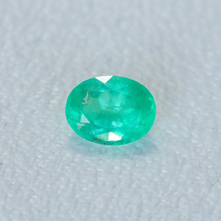 This loose stone is available for a custom ring by Anueva Jewelry. Select your stone first and then select a setting. Add both to your cart and we'll create your ring! 1.29CT OVAL BRILLIANT ZAMBIAN EMERALD, NEON GREEN, 8X6MM. We selected these emeralds for their vibrant, almost neon colors! Natural internal silk, common for emeralds. But still has great flash of sparkle! About Heat Treatments: Some colored gemstones are routinely heated for color and clarity improvement. This is a permanent trea Gia Certified Oval Emerald Gemstone, Gia Certified Oval Emerald, Oval Emerald Gemstones With Prong Setting, Classic Emerald Cut Birthstone Gemstones, Gia Certified Oval Green Gemstones, Oval Emerald Gemstone For May Birthstone, Oval Untreated Green Emerald Ring, Untreated Oval Green Emerald Ring, Oval Green Gemstones For Jewelry Making