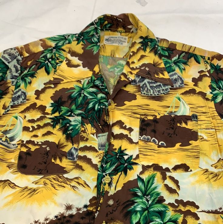 Hawaiian style short sleeve button up shirt 1940-50s Size: M chest-20” shoulder-6” sleeve-8” top to bottom-27” Fitted Short Sleeve Hawaiian Shirt, Casual Vintage Fashion Tops For Summer, Short Sleeve Hawaiian Camp Shirt With Buttons, Hawaiian Camp Shirt With Buttons And Short Sleeves, Hawaiian Camp Shirt With Short Sleeves And Buttons, Hawaiian Camp Shirt With Short Sleeves, Vintage Short Sleeve Shirt With Camp Collar For Summer, Classic Short Sleeve Tops For Vintage Fashion, Classic Vintage Short Sleeve Tops