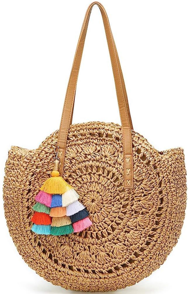 a straw bag with colorful tassels on it