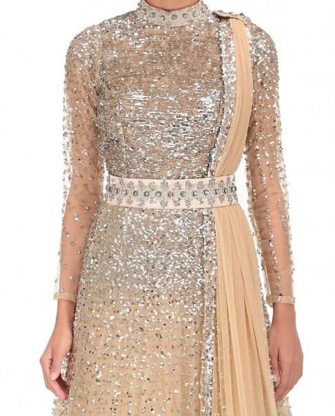 Beige Color Indo Western Gown Glamorous Gown With Sequins And Traditional Drape, Festive Embellished Champagne Gown, Sequin Anarkali Dress For Reception, Hand Embellished Cream Dress For Reception, Glamorous Contrast Sequin Wedding Gown, Fitted Wedding Gown With Contrast Sequin Details, Glamorous Wedding Gown With Contrast Sequin, Hand Embellished Traditional Drape Gown For Parties, Beige Bollywood Dress For Reception