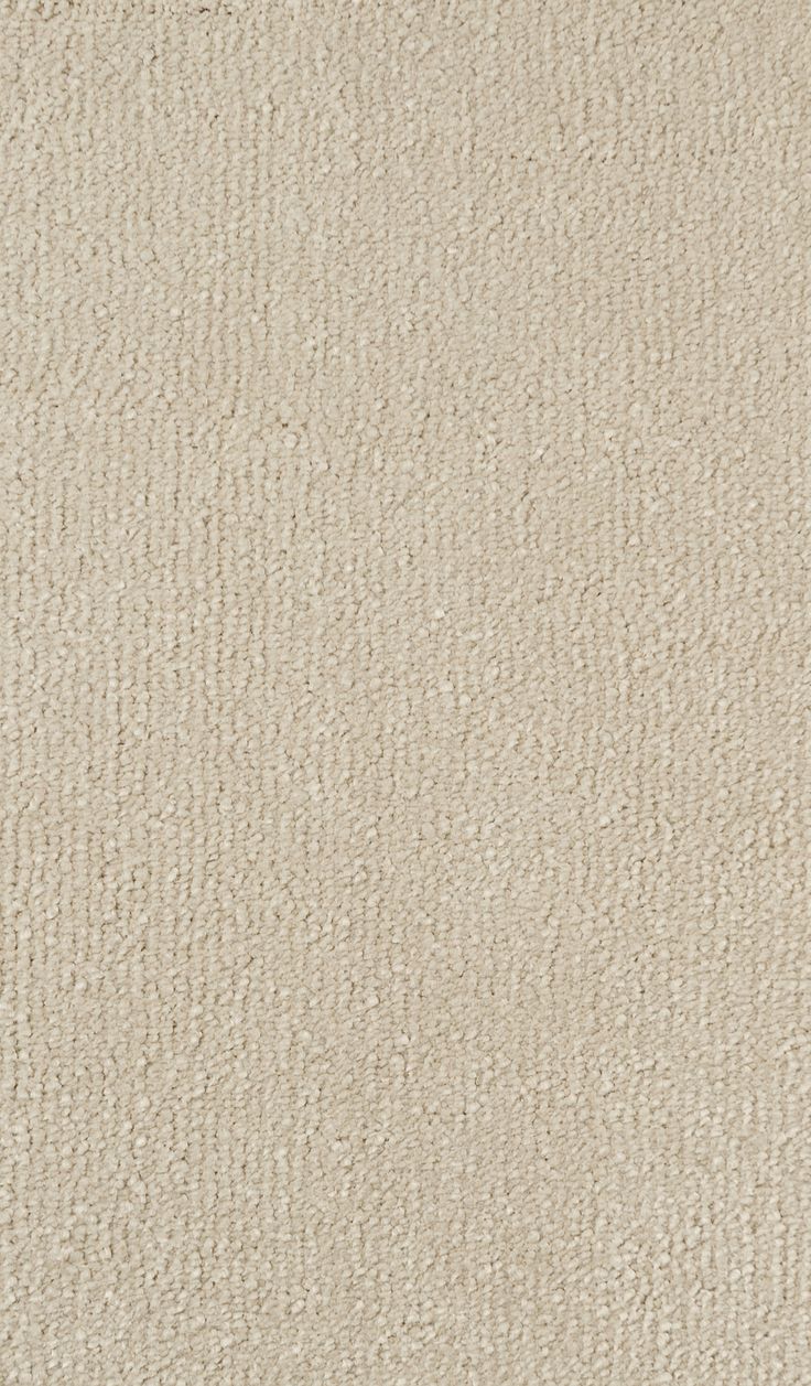 an area rug with white textured material on the top and bottom, in various shades of beige