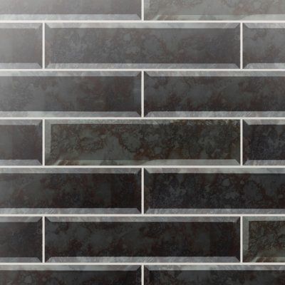 a black and white brick wall with grey marble