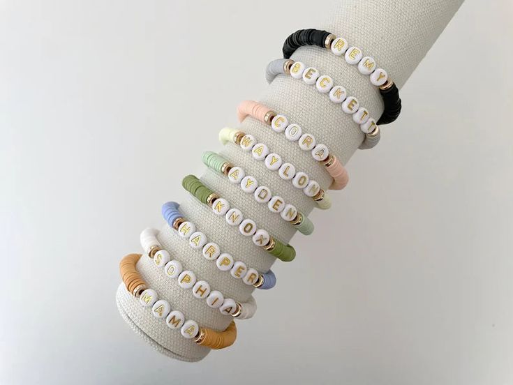 one heishi beaded name bracelet bracelets are made on a durable stretch elastic cord please refer to our sizing guide before purchasing Adjustable Everyday Bracelets With Letter Beads, Adjustable Letter Beads Bracelets For Everyday, Casual Everyday Heishi Beads Friendship Bracelets, Trendy Stretch Bracelet With Letter And Heishi Beads, Trendy Personalized Heishi Beads Stretch Bracelet, Personalized Trendy Heishi Beads Stretch Bracelet, Adjustable Stacked Stretch Bracelet For Friendship, Trendy Heishi Beads Stretch Bracelet For Everyday, Everyday Adjustable Stackable Stretch Bracelet