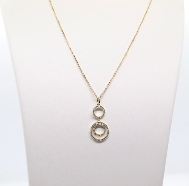 The Gold Loop Necklace is a beautiful piece of jewelry that features double round CZ pendants. It's sure to become a favorite! The necklace is available in a variety of lengths, so you can find the perfect fit. It's also available in a variety of finishes, so you can choose the one that best suits your personal style. Formal Round Pendant Necklace, Formal Round Pendant Chain Necklace, Formal Round Pendant Necklace With Chain, Elegant Long Necklace With Round Pendant For Gift, Round Diamond Necklace With Chain For Gift, Diamond Necklace Gift With Chain, Round Diamond Necklace Gift With Chain, Round Long Chain Necklace For Gift, Elegant Round Charm Necklace