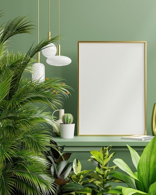 a green room with potted plants and a white framed poster