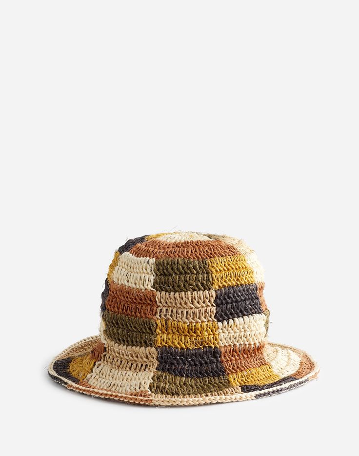 the multicolored hat is made from woven material and has a wide brimmed crown