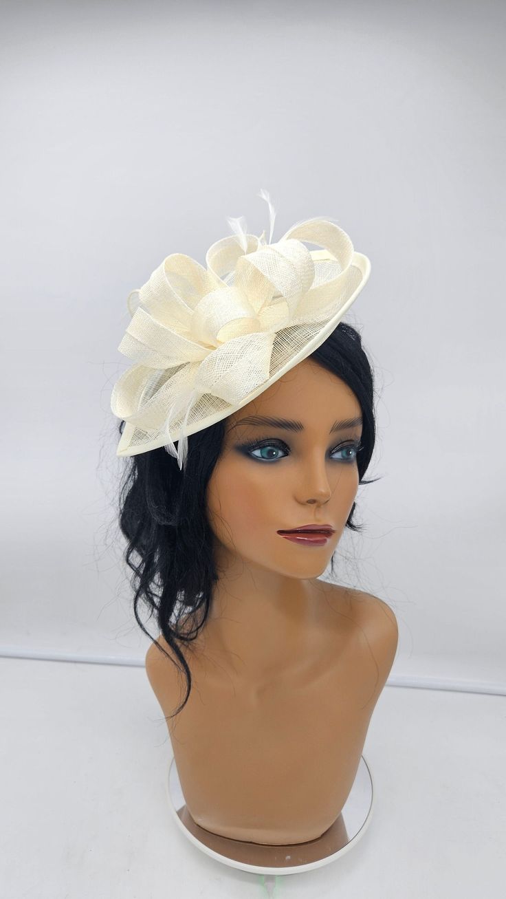 Beautiful ivory  sinamay Fascinator. Sinamay ivory for all occasions- Bridesmaids Hat Kentucky Derby Cocktail Party Tea Party Guest Easter and so on. - Ready to ship - Fast Shipping - Free Shipping - Group discount availalble - Customize by adding different color flowers and or feathers Check my store for more styles and colors.  Hatsandpearls.etsy.com Find more at my website for more styles: www.hatsandpearls.com  Reach out to me if you can't find what you are looking for.  I can make cake custom orders and help you style and match your outfit  Tag and share your pictures when you wear and style our hats.  Instagram: @hats_pearls Facebook: Hats Pearls Thank you for visiting! Cream Hat Headpiece For Church, Cream Hat For Church, Beige Cloche Mini Hat For Wedding, Cream Cloche Fascinator For Church, Cream Wedding Fascinator Hat, Cream Short Brim Costume Hat For Wedding, Cream Short Brim Headpiece For Church, Fitted Cream Costume Hats And Headpieces For Ceremony, Cream Cloche Mini Hat For Wedding