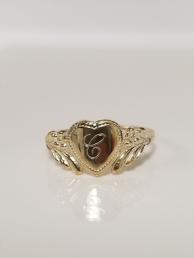 "Thanks for shopping our vintage estate store. We tend to sell well below wholesale and truly hope you enjoy all of our items. Many of the items are one of a kind, so please enjoy scrolling through the pictures and hopefully something will catch your eye. Brown spots are from camera or reflections. Estate 10k yellow gold monogram cursive capital C heart ring. Custom made ring for our shop. Ring size: 3 Setting: 7.5mm 1/4\" to 3/8\" Band width: 1.4mm Weight: .87 gram Marked 10k and it's sweet. On Vintage Jewelry Initial C, Vintage Gold Initial Ring Stamped 14k, Vintage 14k Stamped Initial Ring As Gift, Classic Gold Initial Ring Collectible, Vintage Personalized 14k Gold Engraved Ring, Vintage Engraved Ring With Initials For Promise, Vintage Engraved Promise Ring With Initials, Vintage Engraved Initials Promise Ring, 14k Gold Engraved Ring With Initials For Collectors