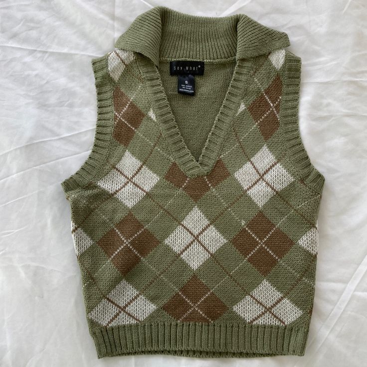 Women’s Collared Vneck Pullover Vest. Made From 100% Acrylic. Lightweight And Brand New. Great For Layering For Fall. Woman’s Vest, Plaid V-neck Tops For Fall, Retro V-neck Winter Tops, Trendy Green V-neck Sweater Vest, Retro Green V-neck Sweater, Trendy Plaid V-neck Top, Trendy Cotton V-neck Sweater Vest, Womens Sweater Vests, Cute Vests