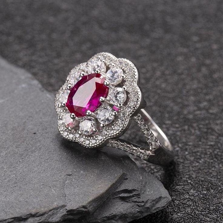 High-end Luxury Elegant Ruby Ring in S925 Sterling Silver Product Features: Ruby is very precious in the Bible. The hot red color of ruby makes people always associate it with passion and love. It is known as the "stone of love", which symbolizes the beauty, eternity and steadfastness of passion like fire. The designer selects high-quality rubies to be cut. Gems are full and lustrous. They are polished to show a smooth and delicate appearance,dazzling and beautiful. Exquisite workmanship creates Ruby Halo Ring For Promise Occasion, Ruby Halo Promise Ring, Classic Cubic Zirconia Ruby Ring, Luxury Lab-created Ruby Promise Ring, Elegant Red Ruby Promise Ring, Luxury Red Halo Ruby Ring, Luxury Red Ruby Ring With Halo, Elegant Silver Ruby Flower Ring, Luxury Ruby Birthstone Promise Ring