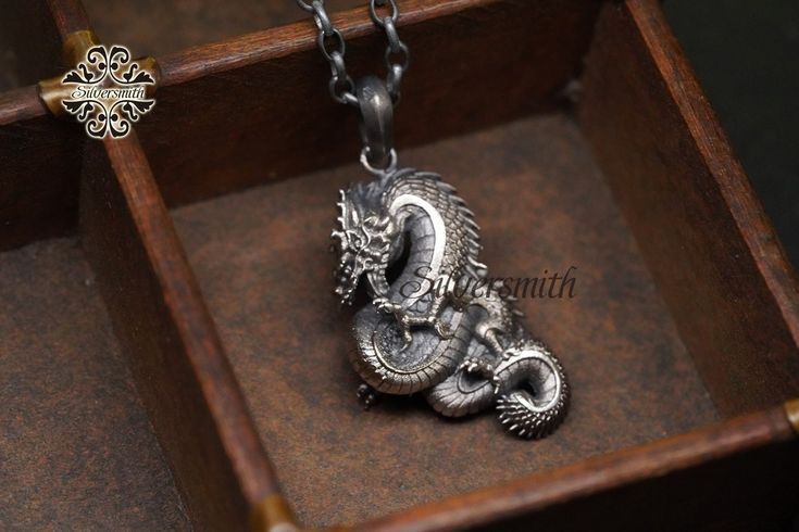 **Silver chain not included ** Click this link to shop our silver chains: https://www.etsy.com/hk-en/shop/silversmithhk?ref=l2-about-shopname&section_id=37505143 Dragon pendant without chain Material: 925 Silver Made in Hong Kong Designed by Ivan Keung Swan Necklace, Silver Swan, Phoenix Pendant, Silver Dragon, Dragon Pendant, Silver Work, Sterling Silver Pendants, Silver Pendant, Silver Color