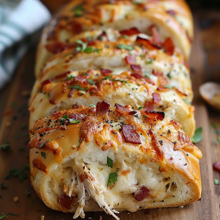 the bread is covered with bacon and cheese on it's side, along with parsley