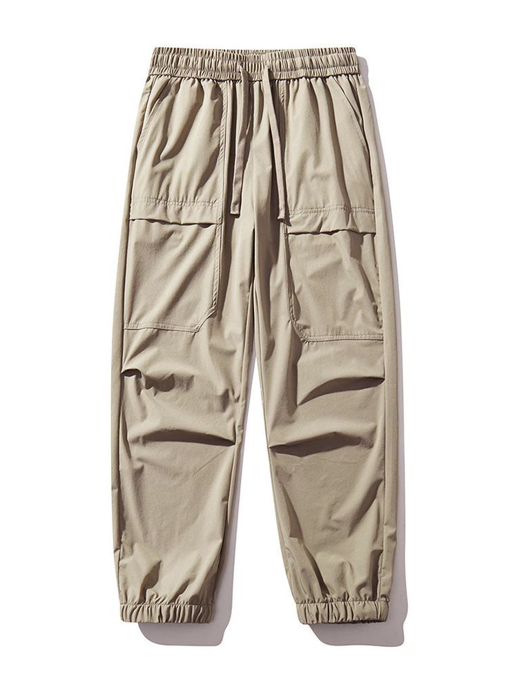 Discover the perfect blend of comfort and functionality with our Elastic Waistband Cargo Pants. Crafted from premium nylon material, these pants offer exceptional durability and a lightweight feel. The elastic waistband guarantees a secure and personalized fit, while the cargo pockets allow for convenient storage of your belongings. Specifications: Material: Nylon Package included: 1*Pants. Size Chart (inches): Size Waist Hip Length S 28.3 44.1 38.6 M 29.9 45.7 39.4 L 31.5 47.2 40.2 Khaki Cargo Pants With Elastic Waistband And Tapered Leg, Techwear Khaki Pants With Side Pockets, Khaki Sports Bottoms With Cargo Pockets, Relaxed Fit Ankle-length Cargo Pants For Outdoor, Functional Parachute Pants For Outdoor Activities, Stretch Khaki Cargo Parachute Pants, Stretch Parachute Pants With Cargo Pockets, Functional Style, Stretch Parachute Pants With Cargo Pockets, Functional Stretch Parachute Pants With Cargo Pockets