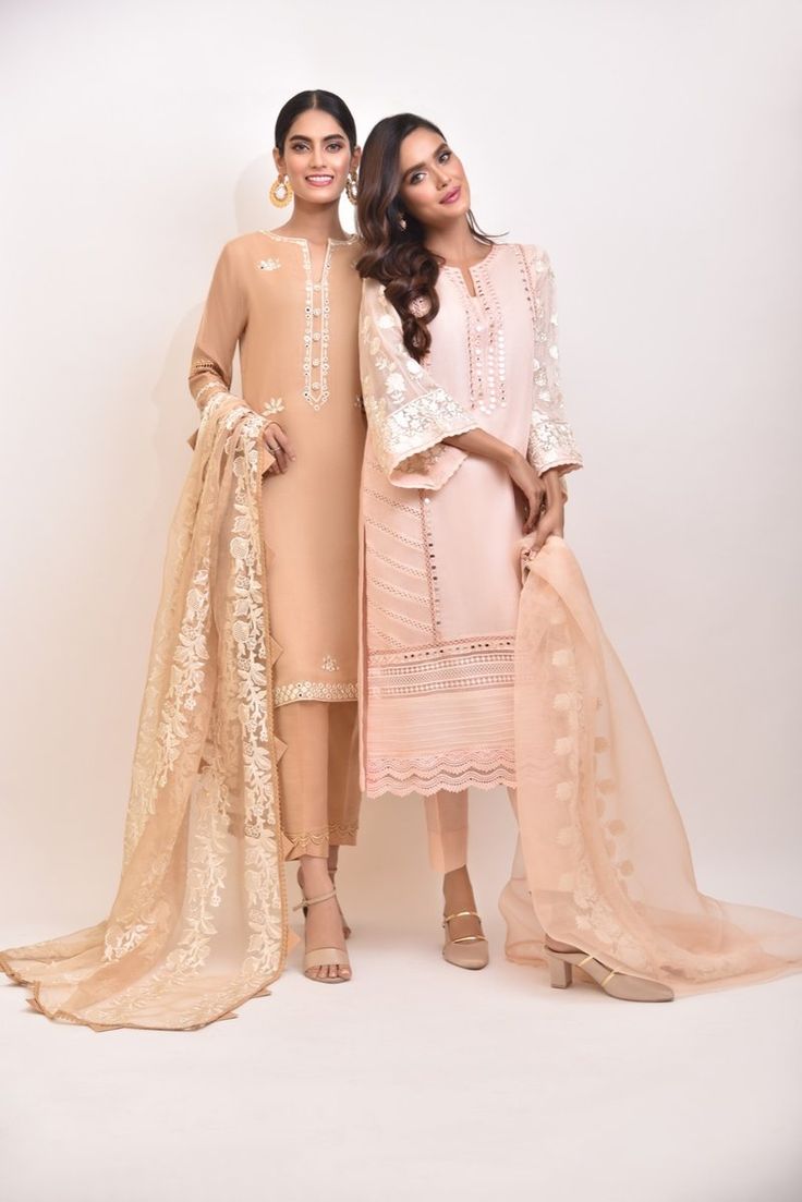 A rich tone of deep beige cotton net with hand sheesha work, paired with a delicate embroidered dupatta and matching raw silk trousers, revamp your wardrobe with this gorgeous three piece. Delivery Time: 6-8 weeks