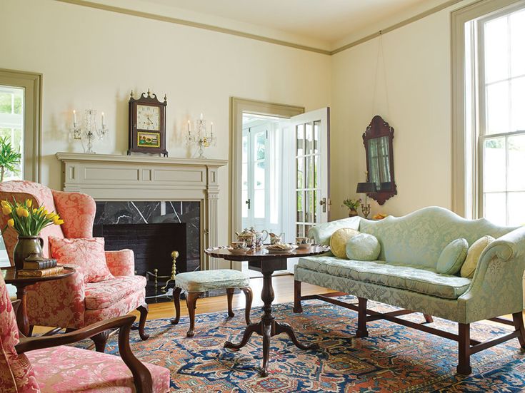 a living room filled with furniture and a fire place