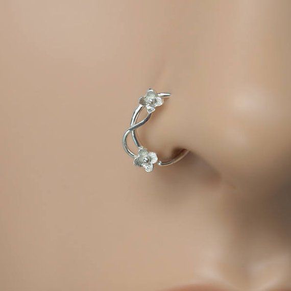 a close up view of the nose piercing on a mannequin's head