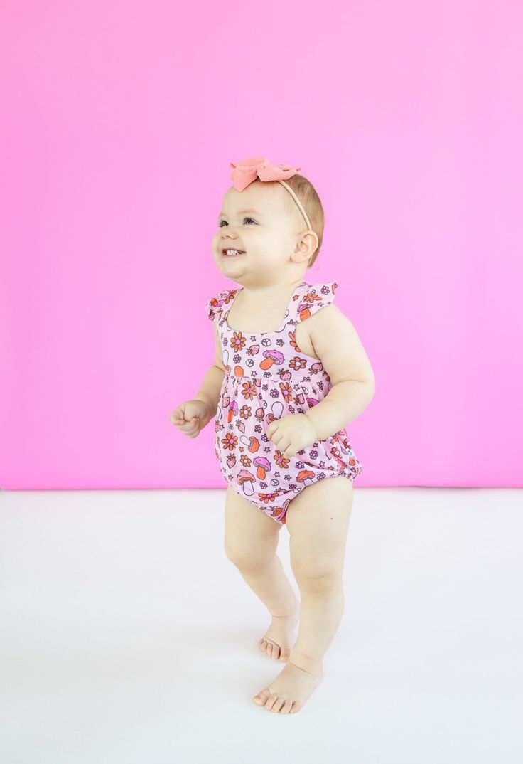 Get ready to embrace your playful side with our Feelin' Mushy Dream Bubble Romper! Made from soft bamboo material, this romper features a whimsical mushroom print in a cute pink color. It's the perfect combination of comfort and fun. Say goodbye to boring outfits and hello to a new level of cuteness! Made from the softest and most breathable bamboo viscose material, your babe won't want to take this off! Designed for all the love and extra snuggles! Sleep and play with zero irritation with our tag-less garment tags! Boring Outfits, Tuxedo Accessories, Girls Gloves, Girls Dress Outfits, Toddler Flower Girl Dresses, Mushroom Print, Infant Flower Girl Dress, Bamboo Material