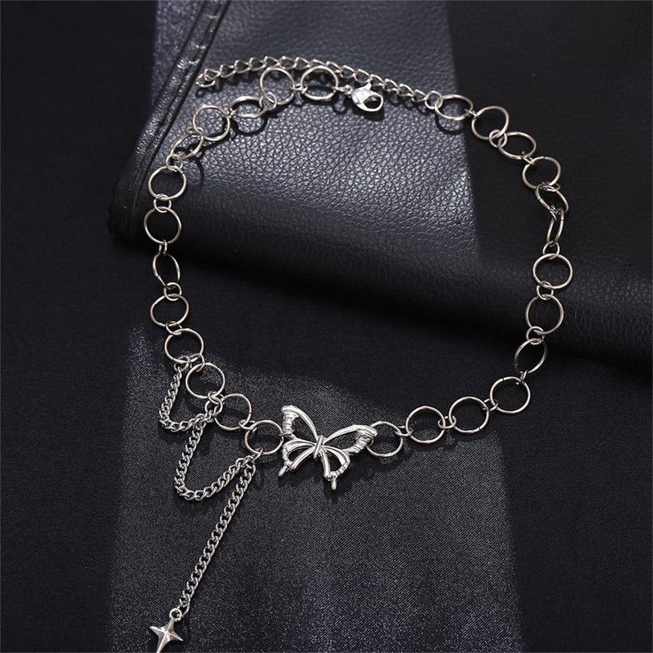 This choker boasting a bold chain look and butterfly charm accents any ensemble with stylish flair. Chain : 13.19" L with 2.76" extender 2.48" drop Lobster claw clasp Silver-plated copper Butterfly Choker, Grunge Jewelry, Neck Choker, Party Necklace, Silver Anklets, Neck Chain, Chain Choker Necklace, Fancy Jewelry, Punk Style