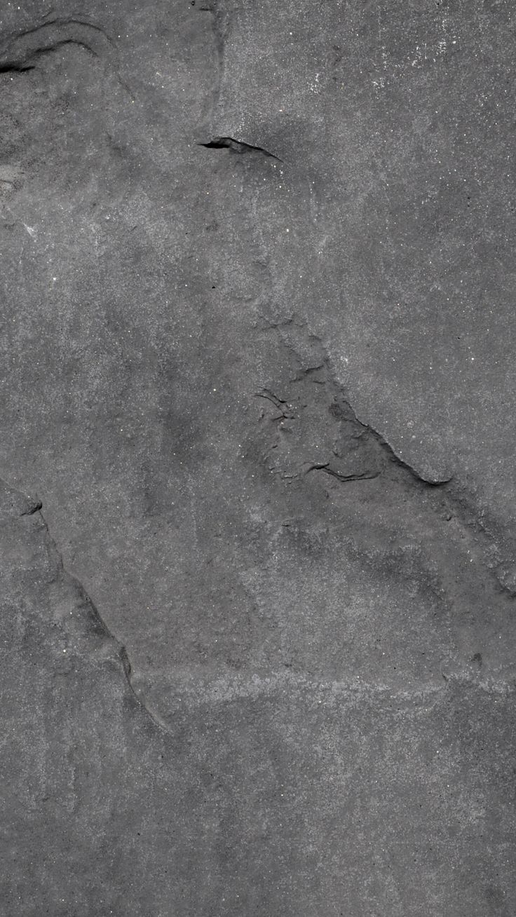 a black and white photo of a rock with cracks in the middle, as seen from above