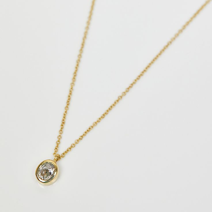 18k Yellow Gold Necklace featuring a conflict-free 0.48ct Oval Salt and Pepper Diamond A beautiful gift to a loved one or treat yourself with this stunning diamond necklace. Wear this alone or layer it with your favourite other necklaces. This necklace chain is 16 inches and would look great layered with other longer or shorter necklaces. The diamond is natural and not treated or heated for colour or clarity. Necklace Details: Stone - Diamond - Shape: Oval - Carat weight: 0.48 - Colour: Transpar Luxury Oval Diamond Necklace With Rose Cut, Oval Diamond Pendant Necklace With Rose Cut, Oval Pendant Jewelry With Single Diamond, Timeless Oval Necklace With Single Diamond, Classic Oval Link Diamond Necklace For Gift, Classic Oval Necklace With Rose Cut Diamonds, Classic Oval Rose Cut Diamond Necklaces, Oval Rose Cut Diamonds Necklace In Fine Jewelry Style, Oval Rose Cut Diamond Necklace - Fine Jewelry