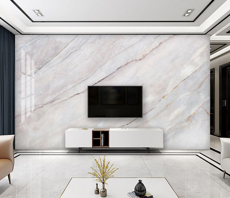 a living room with marble walls and white furniture