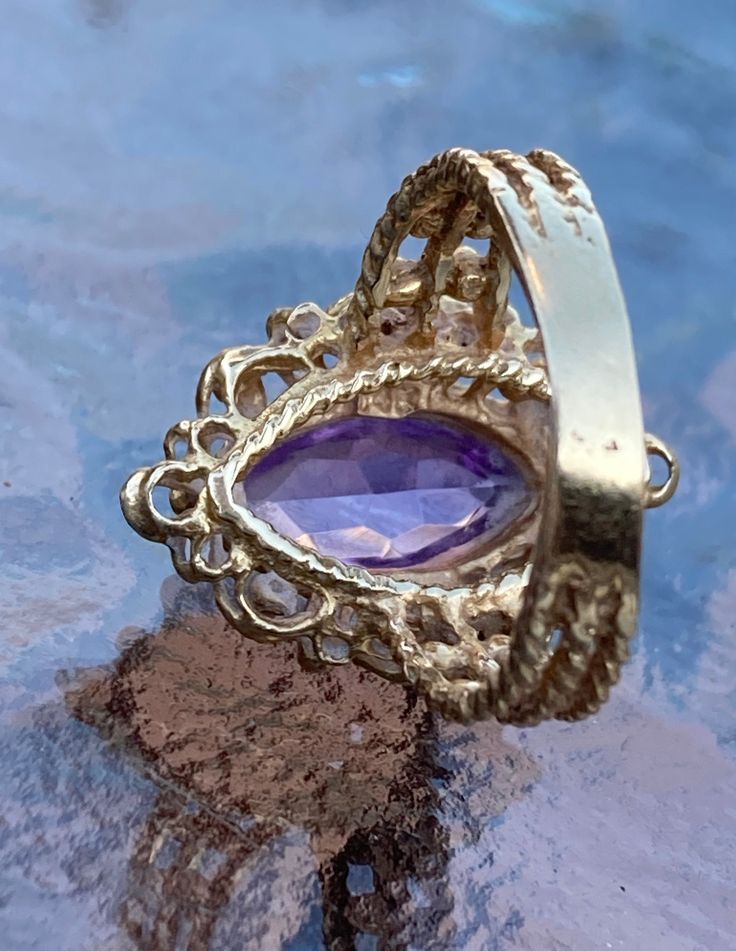 ~ Vintage, 14K Gold, Victorian Amethyst Ring. Ring Size 7, Weighs Approximately 6.57 Grams On My Scale. This Exquisite Victorian Ring Is Even More Stunning In Person. With A Large 12mm Amethyst Stone In The Middle. In Excellent Condition. ~ Due To The Unique Nature Of Antiques & Vintage Items, They Are Being Sold As Is. Please Keep In Mind, That Most Of All Antiques & Vintage Items Will Show Wear & Imperfections Consistent With Their Age And Use. Please Look At The Pictures Provided Gold Amethyst Jewelry With Accent Stones, Fine Jewelry Amethyst Ring Stamped 14k, Fine Jewelry Amethyst Gold Ring, Heirloom Amethyst Ring With Center Stone In 14k Gold, Fine Jewelry Gold Amethyst Ring, Heirloom 14k Gold Amethyst Ring With Center Stone, Yellow Gold Amethyst Jewelry With Center Stone, Heirloom Amethyst Ring With Accent Stones, Heirloom 14k Stamped Amethyst Jewelry