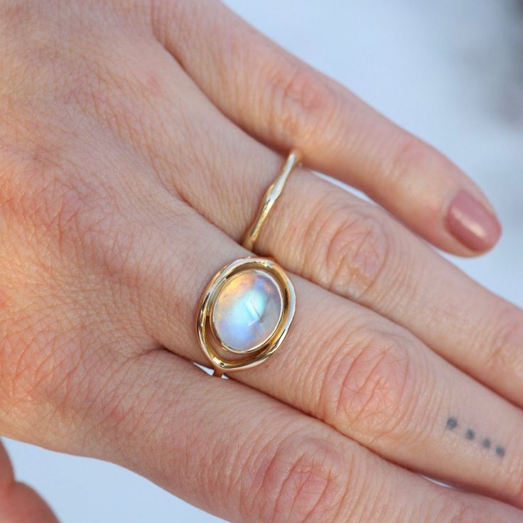 Moonstone cabochon 14k yellow gold 1.3mm band thickness Handmade by Halcyon Jewelry in Maine Timeless jewelry made by hand. Inspired by the ancients, imbued with magic, and made with love & sustainability in mind. Made with recycled metals and responsibly sourced stones. Moonstone Jewelry, Handmade Rings, Timeless Jewelry, Recycled Metal, Moonstone Ring, Made With Love, Handmade Ring, Moonstone, Diy Jewelry