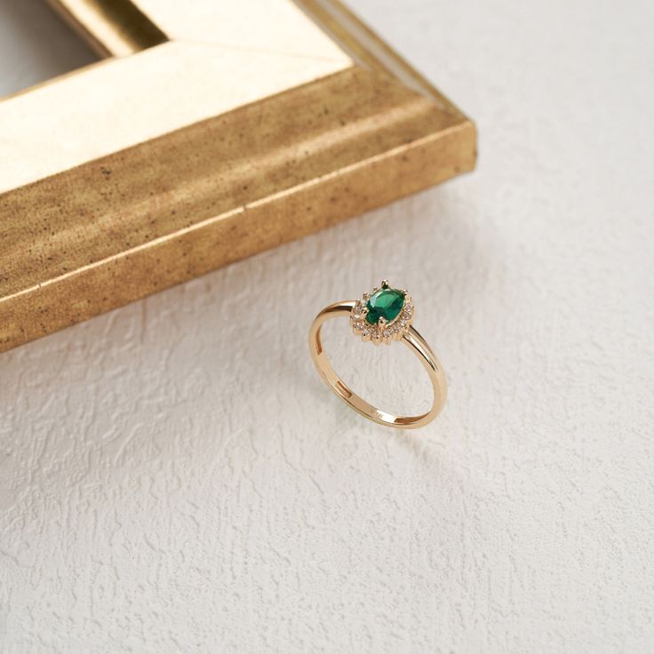 Introducing our exquisite 14K Solid Gold Emerald May Birthstone Ring - a celebration of timeless beauty, personalized elegance, and the enchanting allure of Emerald gemstones. This exquisite piece is more than just a ring; it's a symbol of your unique story and a tribute to the vibrant spirit of May birthdays. Crafted with meticulous attention to detail, this oval-cut Emerald ring showcases the golden radiance of this birthstone, believed to bring joy, abundance, and positive energy to its weare Stackable Gemstone Rings, Smaragd Ring, Emerald Ring Vintage, May Birthstone Rings, May Birthday, May Birthstone, Ring Oval, Pave Setting, Crystal Ring