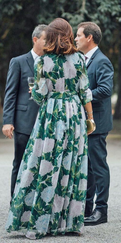 two men and a woman standing next to each other