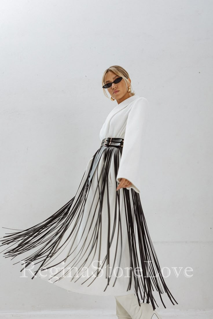 Step into the world of bohemian chic with our stunning Belt with Fringe. This fashion-forward accessory is the perfect addition to elevate your dress, accentuate your waist, and make a bold fashion statement. Crafted with care and attention to detail, this fringe belt exudes a sense of effortless style and adds a touch of flair to any outfit. Choose from an array of captivating colors to match your personal style and wardrobe. From classic black and timeless brown to vibrant red, feminine pink, Blue Fringe Belt, Harness Skirt, Red Feminine, Dress Festival Outfit, Rave Outfits Women, Skirt Fringe, Belt For Dress, Skirt With Fringe, Fringe Belt