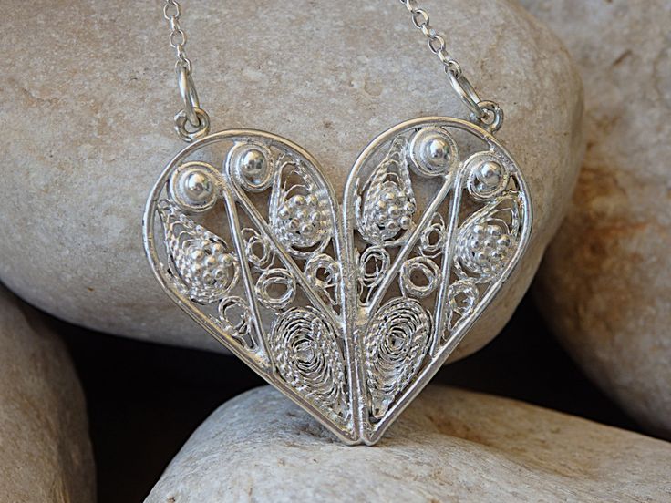 Silver sterling 925 Heart Shaped Necklace, Yemenite necklace, Ethnic Tribal hand made jewelry. Filigree love pendant. Women wife gift idea's Details: Metal: 925 Sterling Silver Size: 3 cm x 3 cm (1.2 inches x 1.2 inches) Chain Length: 45 cm (about 18 Inches) and can be change please write your size long chain in note The necklace will be packed in a gift box. Please allow 2-5 days to prepare. FOR MY NECKLACES COLLECTION HERE: https://www.etsy.com/il-en/shop/rebekajewelry?section_id=14211169& Artisan Heart-shaped Jewelry For Anniversary, Artisan Silver Heart Pendant Necklace, Traditional Heart Shaped Jewelry Gift, Spiritual Handmade Jewelry With Heart Pendant, Traditional Handmade Heart Jewelry, Unique Heart Pendant Jewelry For Wedding, Traditional Heart-shaped Jewelry Gift, Traditional Handmade Heart-shaped Jewelry, Unique Heart Pendant Wedding Jewelry