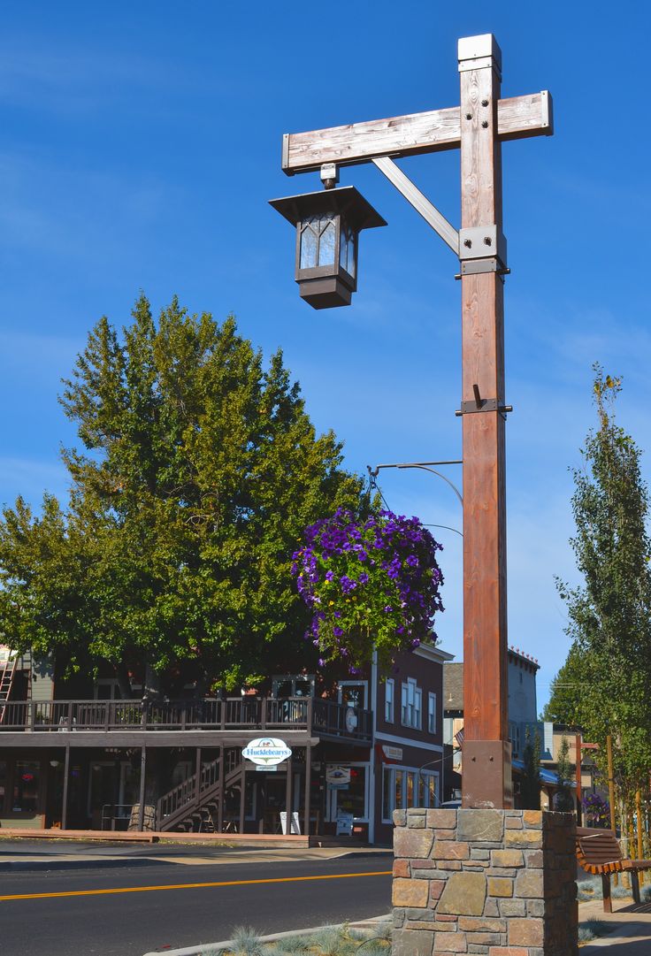 a large wooden cross on the side of a road