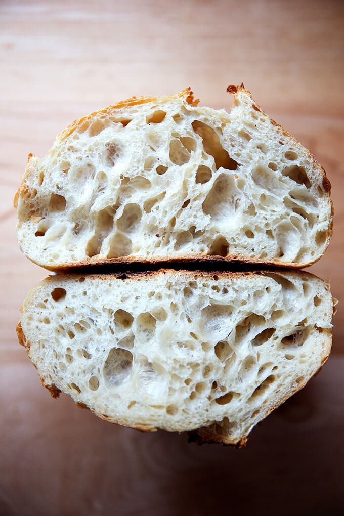 two pieces of bread sitting on top of a wooden table