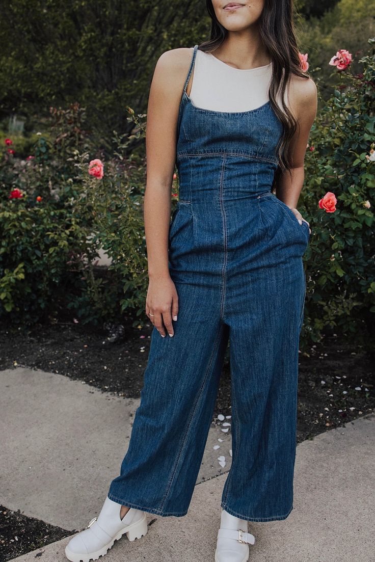 Description Wide Leg Denim Jumpsuit. Criss Cross tie back detail. Materials & Care Shell 100% cotton Hand wash cold, do not bleach, do not tumble dry, hang dry Hand Measured Small: Inseam 25.5" Waist 12.5 (25)" Medium: Inseam 26" Waist 13(26)" Large: Inseam 26.5" Waist 13.5(27)" Model is wearing a size small Model pictures have been edited, please refer to video for actual color reference. Fitted Washed Denim Jumpsuit, Fitted Medium Wash Overalls With Pockets, Fitted Cotton Overalls In Washed Blue, Fitted Overalls With Pockets In Medium Wash, Fitted Light Wash Overalls For Summer, Fitted Blue Washed Denim Jumpsuit, Fitted Straight Leg Cotton Denim Jumpsuit, Fitted Cotton Denim Jumpsuit With Straight Leg, Cotton Fitted Washed Jumpsuits And Rompers