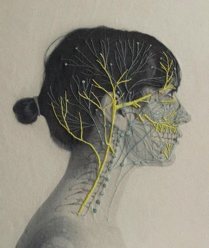 a drawing of a woman's head with branches on it